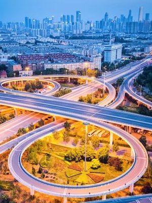 modern-interchange-road-with-city-skyline-PPA43RK